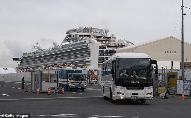 A bus carrying passengers from the Diamond Princess - in this case passengers who were about to be flown home by the Israeli government - drives away from the cruise ship in Yokohama last week